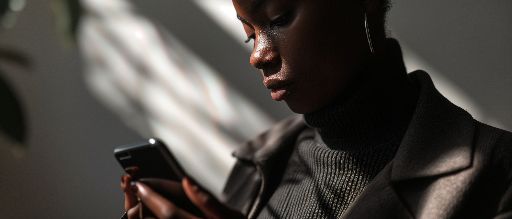 person holding smartphone, soft lighting