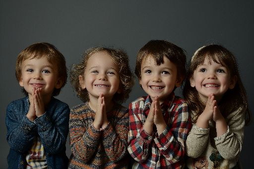 Happy children studio portraits on gray background